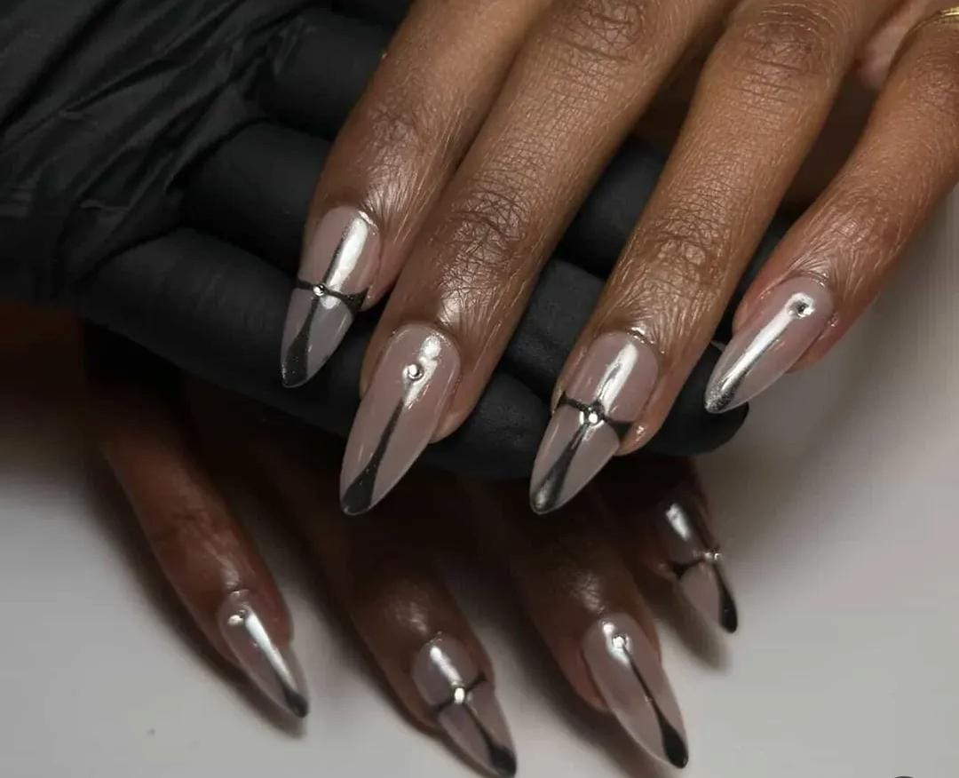 Nude stiletto nails with silver chrome tips and gems by Eilish Bratz